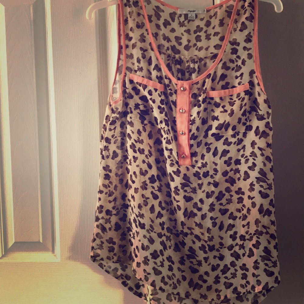 Cheetah and pale pink sleeveless blouse.